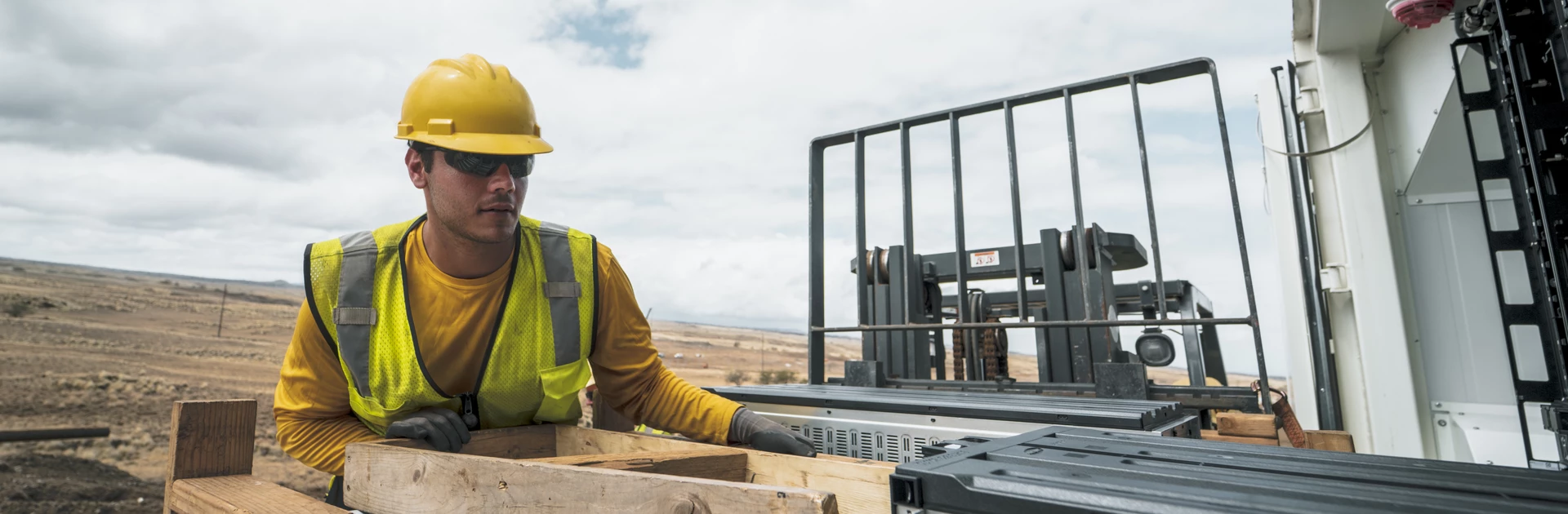 Man in safety hard hat doing construction